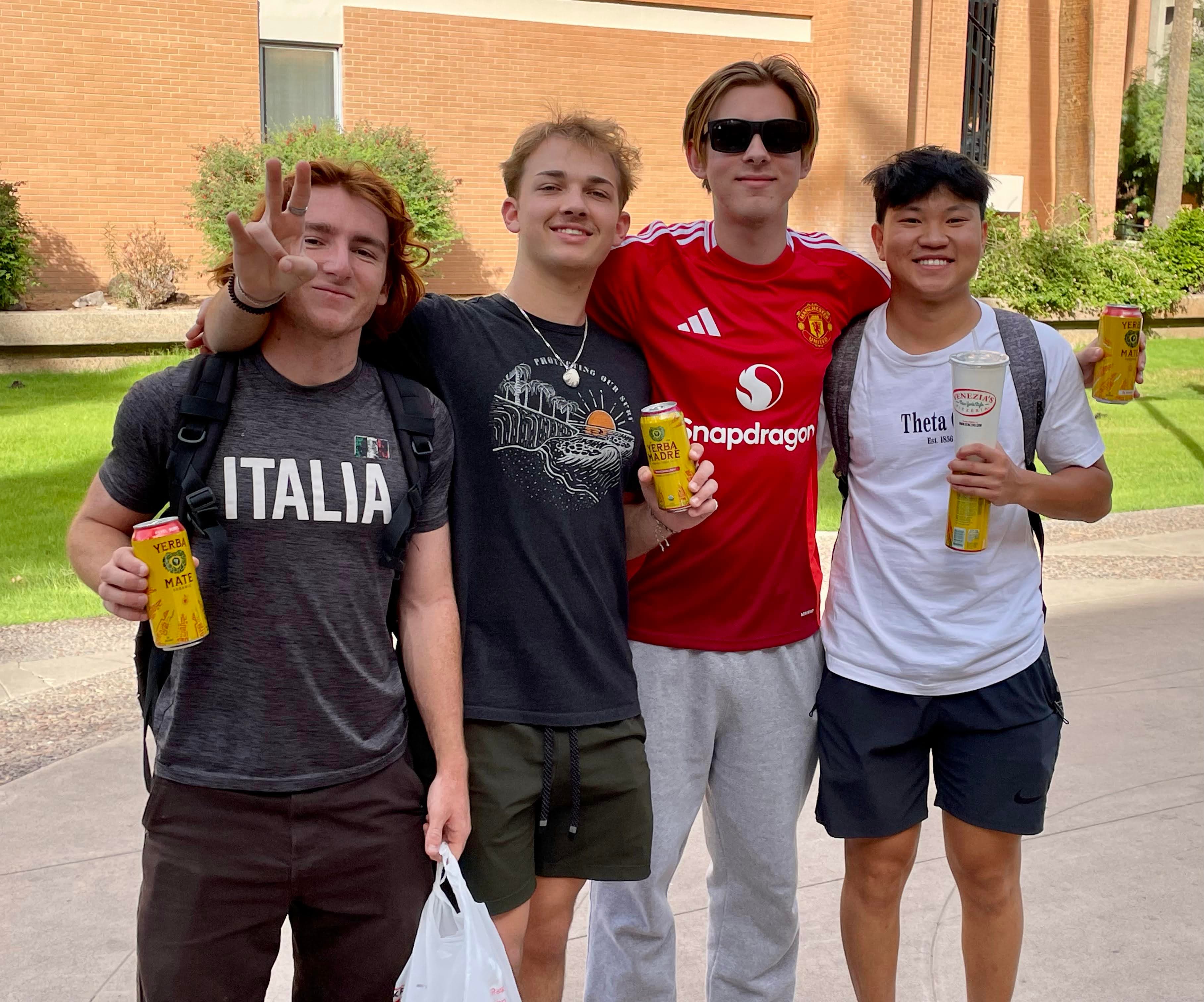 Out There members hanging out after class with sponsor drinks